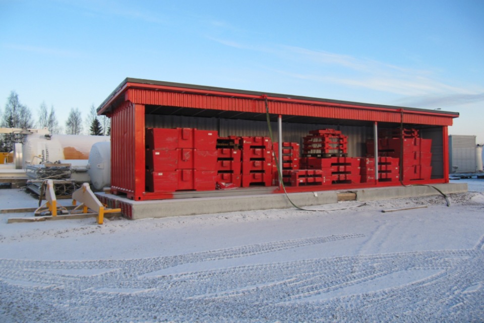 Red warehouse with weigh lifting euipment